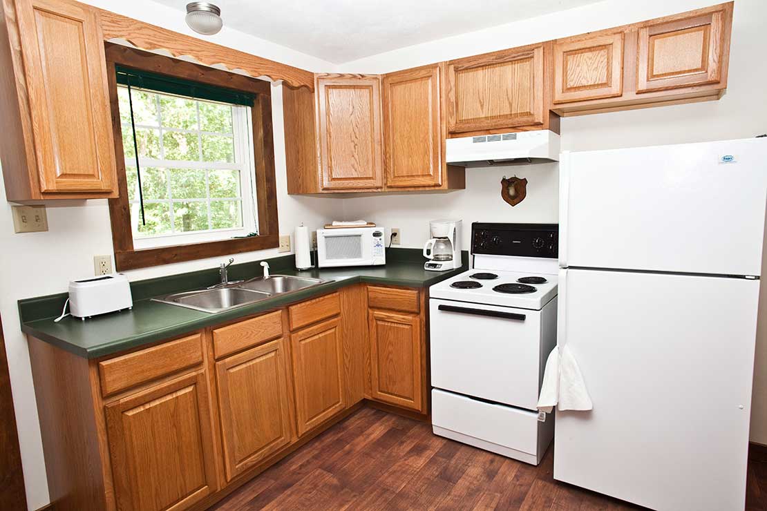 Outdoorsman cabin's fully furnished kitchen